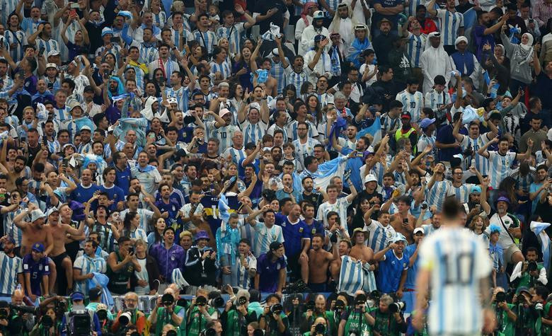 Argentina fans in the stands react during the match with Lionel Messi pictured in the foreground. (Photo: REUTERS)