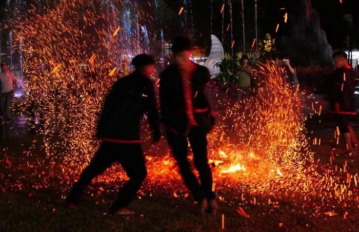 Pa Then men jump into the live coals. Pa Then men jump into the live coals.