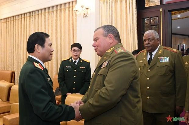 Divisional General Víctor Rojo Ramos welcomed by Sen. Lieut. Gen. Nguyen Tan Cuong. (Photo: VNA)