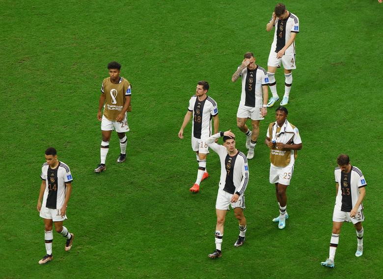 Germany's Kai Havertz, Jamal Musiala and Thomas Muller looks dejected after the match as Germany are eliminated from the World Cup. (Photo: REUTERS)