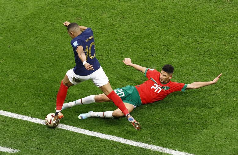 France's Kylian Mbappe in action with Morocco's Achraf Dari. (Photo: REUTERS)