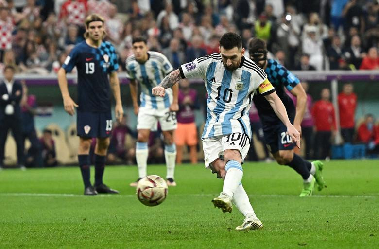 Argentina's Lionel Messi scores their first goal from the penalty spot. (Photo: REUTERS)