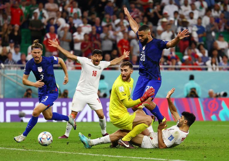 Iran's Mehdi Taremi in action with Matt Turner of the US. (Photo: REUTERS)