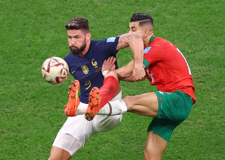 France's Olivier Giroud in action with Morocco's Jawad El Yamiq. (Photo: REUTERS)