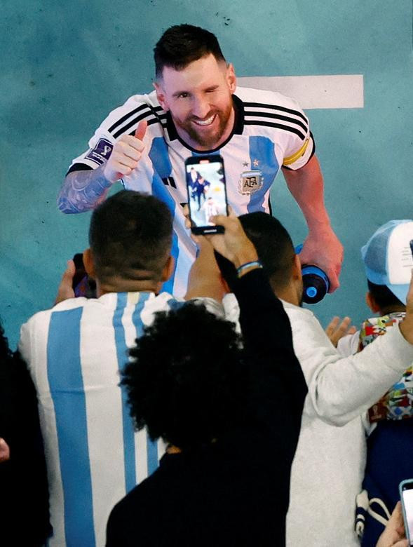 Argentina's Lionel Messi celebrates with fans after the match. (Photo: REUTERS)