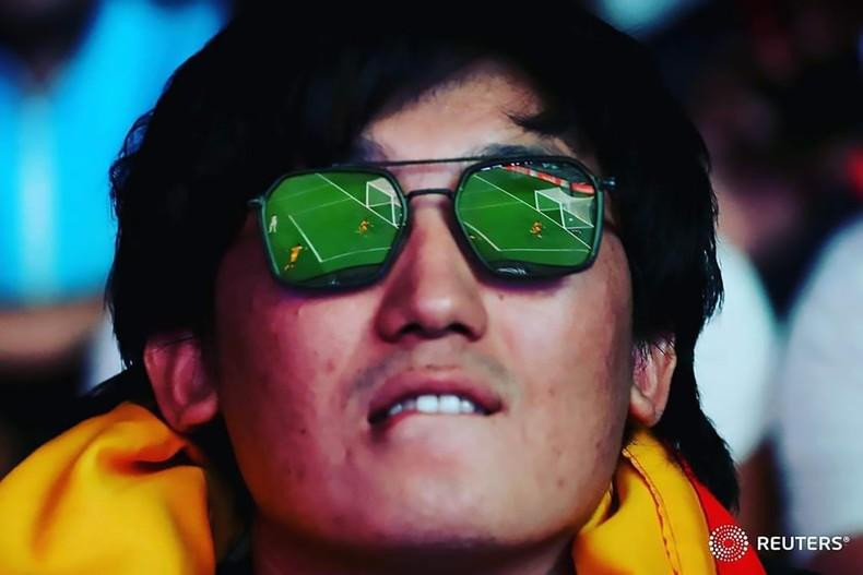 A fan is seen watches the match between Senegal and Netherlands. (Photo: Reuters)