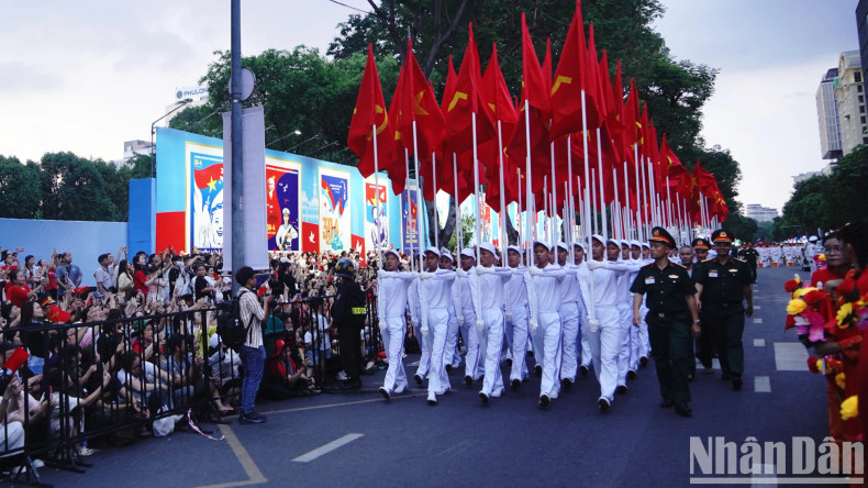 The crowd grow more excited as the parade procession move along the streets.