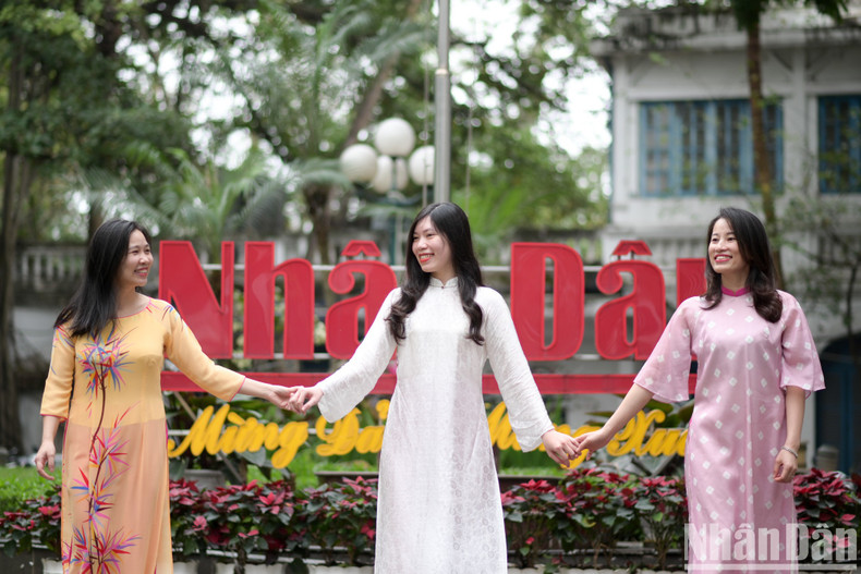 Female reporters and employees of Nhan Dan Newspaper appear even more graceful and beautiful in their traditional Ao Dai.
