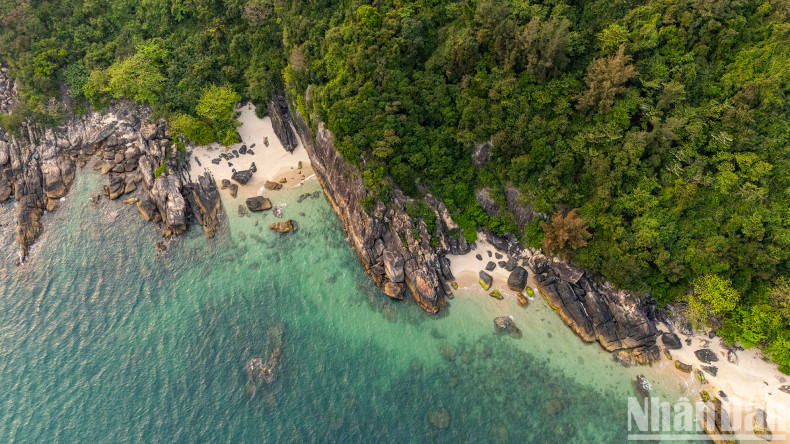 Magnificent rock formations surround the island as seen from above. Magnificent rock formations surround the island as seen from above.