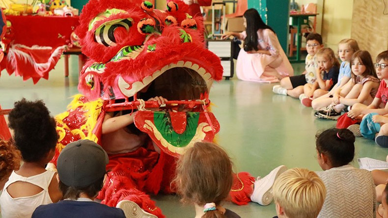 Children watching 'mua lan' (dragon dance)