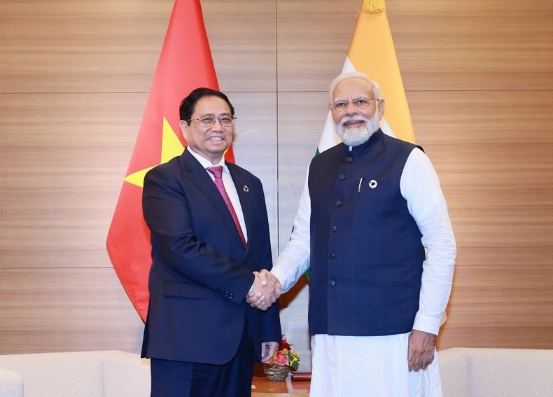 PM Pham Minh Chinh (L) and his Indian counterpart Narendra Modi. (Photo: Duong Giang)
