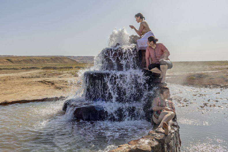 Women visit a hot spring that has emerged from the dried bed of the Aral Sea, near Akespe village, Kazakhstan. In recent years, the Aral Sea has lost 90% of its content. (Source: World Press Photo)