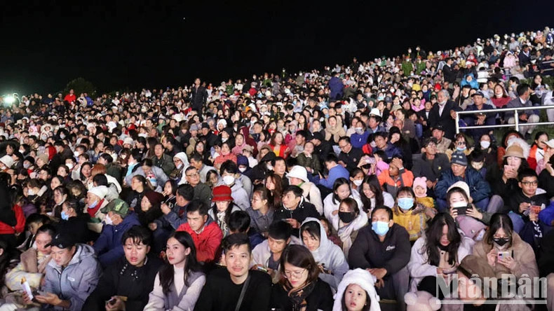 A large number of locals and tourists attend the ceremony.
