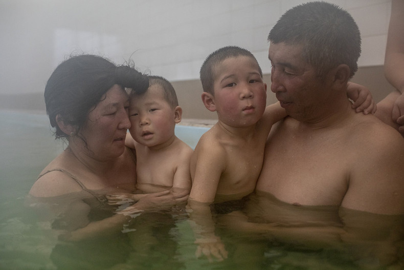 Jaynagul Brjieva (37) and her family enjoy an outing to a hot spring in Kaji-Say, Kyrgyzstan. This is a unique opportunity for Jaynagul's children to take a warm bath in an area facing severe water shortages. (Photo: Anush Babajanyan)