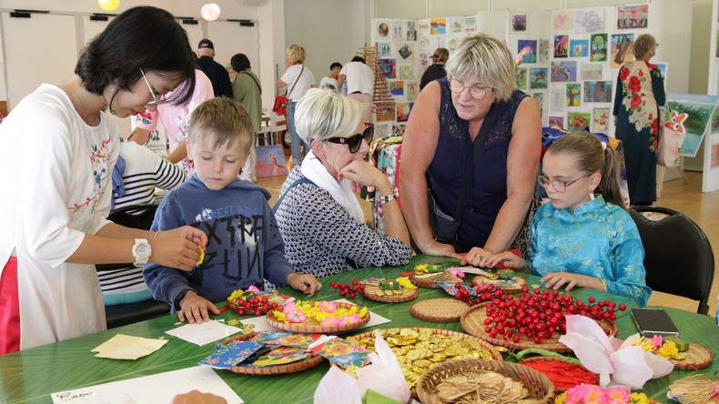 French children are excited to discover Vietnamese culture. French children are excited to discover Vietnamese culture.