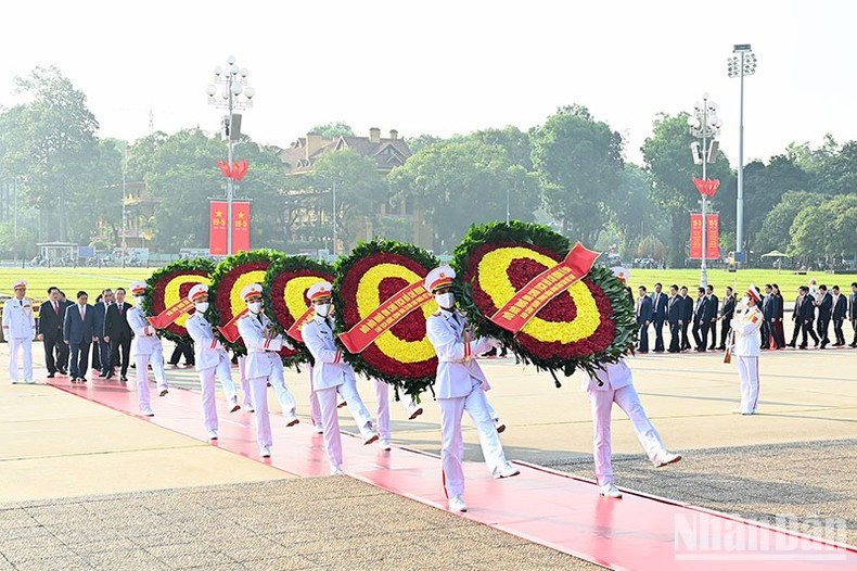 The delegation's wreath carries the words "forever grateful to the great President Ho Chi Minh”.