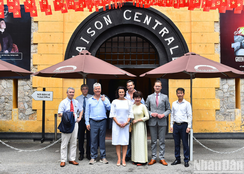 President of the Belgian Senate Stephanie D'Hose and members of the Belgian delegation speak with officials and staff of Hoa Lo Prison Relic Site.