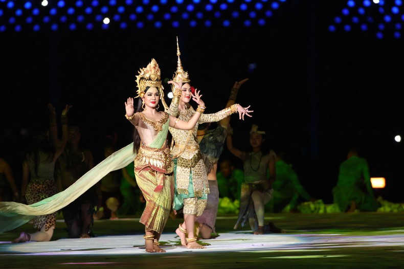 Cambodian women wear traditional costumes and perform an Apsara dance.
