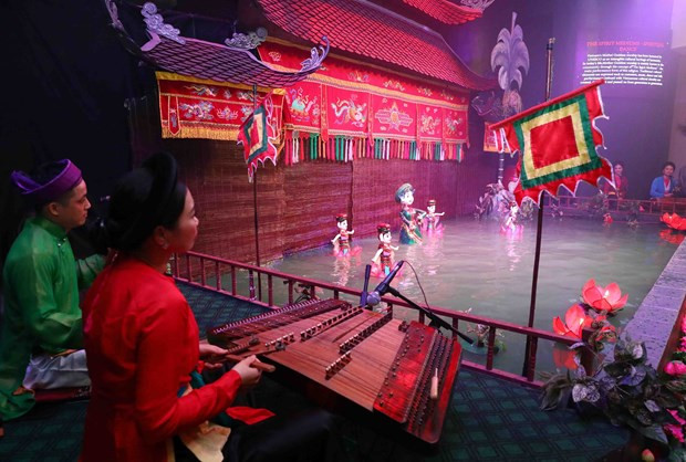 A water puppetry performance at the programme. (Photo: VNA)