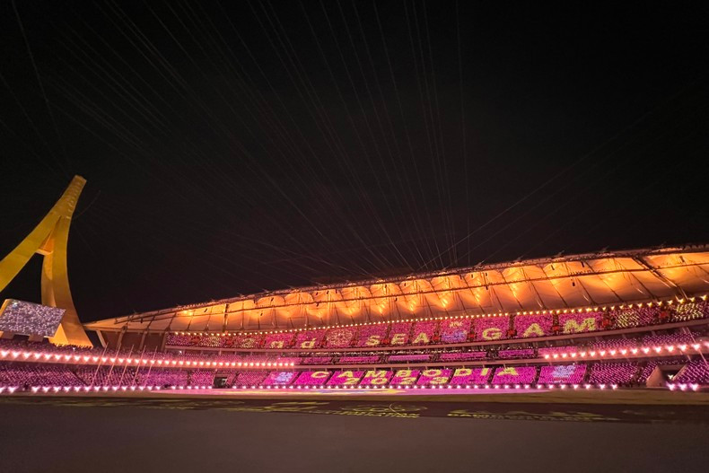 Morodok Techo National Stadium is filled with colourful lights.