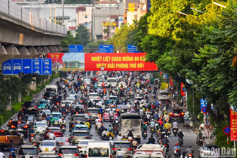 The image of Nguyen Trai Street with the dominant red colour of the large-sized posters.