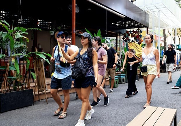 Spanish tourists visit Book Street in Ho Chi Minh City (Photo: VNA)