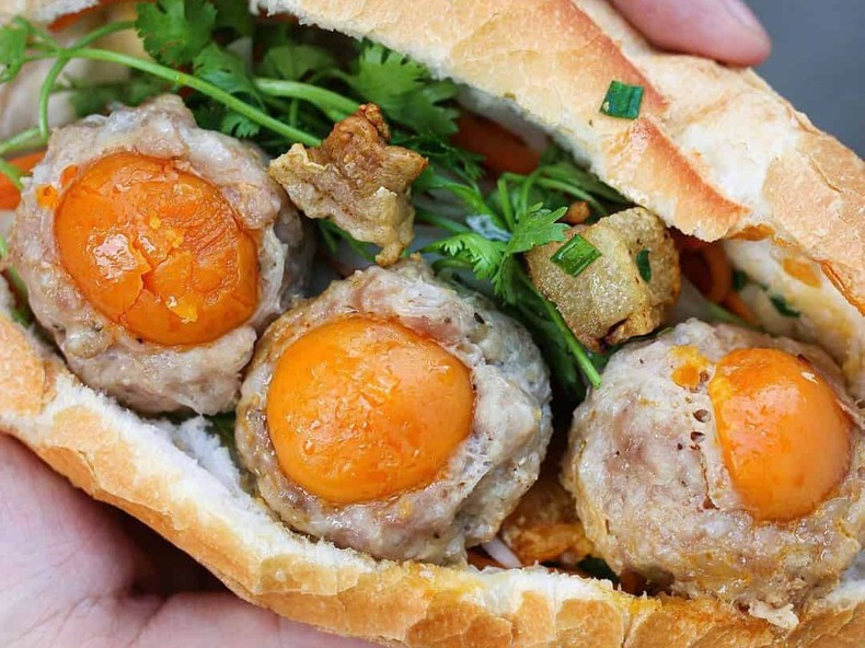 Ho Chi Minh City is famous for 'banh mi xiu mai trung muoi'.