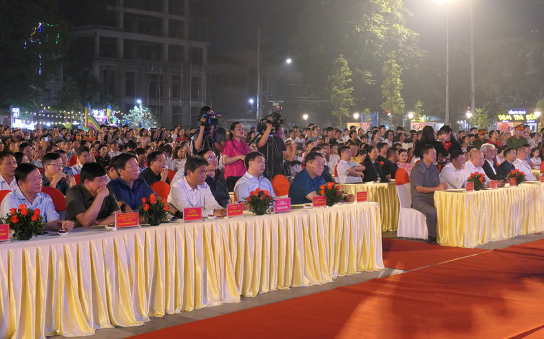 Other delegates attend the opening ceremony for the display.