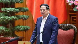 Prime Minister Pham Minh speaks at the working session. (Photo: VGP)