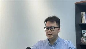 Enzo Sim Hong Jun, a Malaysian researcher specialising in Southeast Asian history and defence, grants an interview to the Vietnam News Agency. (Photo: VNA)