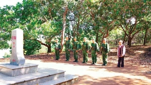 Elder Ksor Bong often patrols the border adjacent to Cambodia together with border guards.