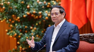 Prime Minister Pham Minh Chinh addresses the meeting meeting between the permanent Government members and leaders of Hanoi to review and provide feedback on the draft Ha Noi Capital Master Plan with a 100-year vision on March 14. (Photo: baochinhphu.vn)