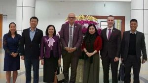Dr Aleksandar (Sasha) Bodiroza takes a photo with representatives and officials of the Ministry of Health and UNFPA. (Source: UNFPA)