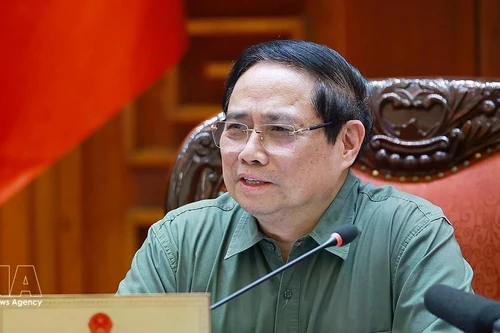 Prime Minister Pham Minh Chinh speaks at the meeting between standing Government members and representatives of ministries, agencies and Phu Tho province (Photo: VNA)