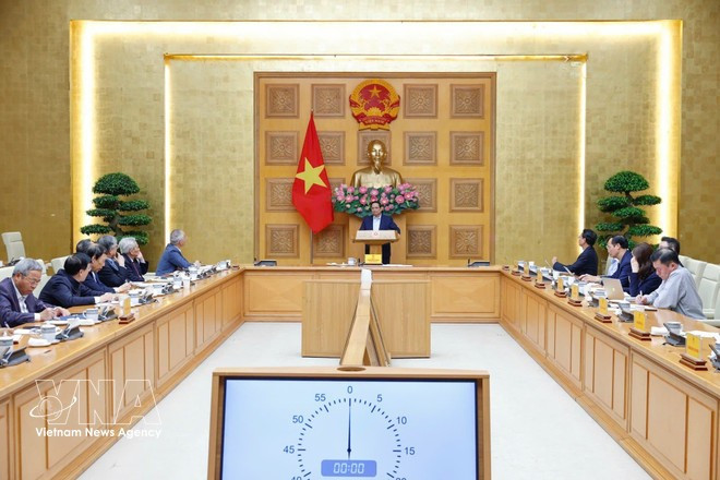 At the meeting between Prime Minister Pham Minh Chinh with the Policy Adviory Council in Ha Noi on March 7, 2026. Photo: VNA