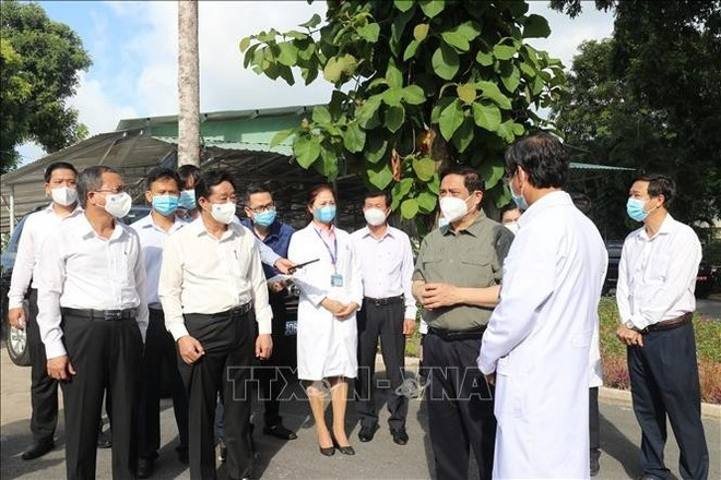 On the morning of June 27, 2021, a government delegation led by Prime Minister Pham Minh Chinh conducts an inspection of the COVID-19 prevention and treatment work at Binh Duong General Hospital. (Photo: VNA) On the morning of June 27, 2021, a government delegation led by Prime Minister Pham Minh Chinh conducts an inspection of the COVID-19 prevention and treatment work at Binh Duong General Hospital. (Photo: VNA)