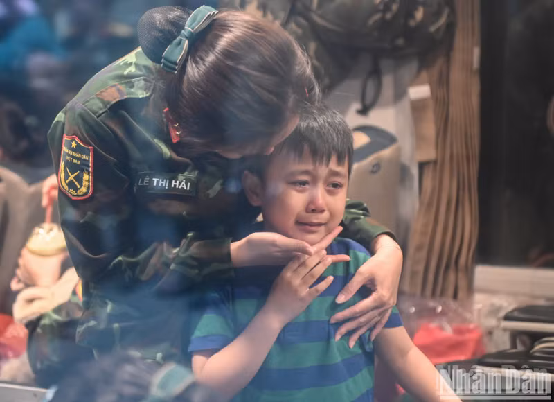 A boy could not hold back his tears as he said goodbye to his mother. A boy could not hold back his tears as he said goodbye to his mother.