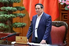 Prime Minister Pham Minh speaks at the working session. (Photo: VGP)