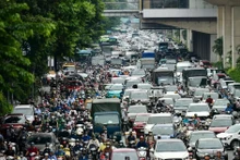 Vehicles crowd the streets of Hanoi during rush hour. (Photo by THE DAI)