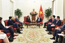 Minister of Foreign Affairs Le Hoai Trung meets with Canada's Minister of International Trade Maninder Sidhu on February 12, 2026. (Photo: Ministry of Foreign Affairs)