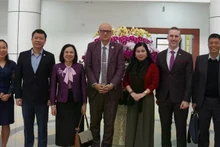 Dr Aleksandar (Sasha) Bodiroza takes a photo with representatives and officials of the Ministry of Health and UNFPA. (Source: UNFPA)