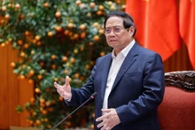 Prime Minister Pham Minh Chinh addresses the meeting meeting between the permanent Government members and leaders of Hanoi to review and provide feedback on the draft Ha Noi Capital Master Plan with a 100-year vision on March 14. (Photo: baochinhphu.vn)