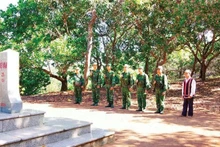 Elder Ksor Bong often patrols the border adjacent to Cambodia together with border guards.