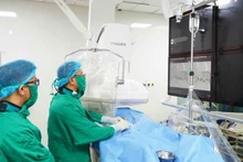 Doctors at Thai Nguyen Central Hospital perform hepatic embolisation techniques.
