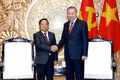 Party General Secretary and State President To Lam and Lao Deputy Prime Minister and Minister of Justice Khamphan Phommathat at the reception.