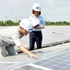 Inspecting and maintaining solar batteries at the Aquaone Hau Giang Water Plant. (Photo: Quoc Tuan)