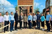 Representatives of the US Consulate General in Ho Chi Minh City, together with officials from the Viet Nam Disaster and Dyke Management Authority, visit a house constructed under the Quang Trung Campaign in Gia Lai province, December 2025.