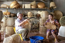 Artisans at work in a bamboo and rattan workshop in Phu Vinh Village, Phu Nghia Commune, Ha Noi.