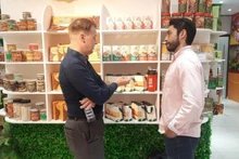 Foreign investors examine products of enterprises from Ho Chi Minh City displayed at the Investment and Trade Promotion Centre of Ho Chi Minh City.