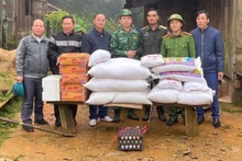 Providing food and supplies to Lao border protection forces isolated for days by floodwaters.